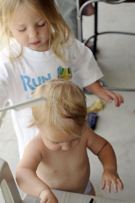 Kristina grabs a spare comb for Annie's hair