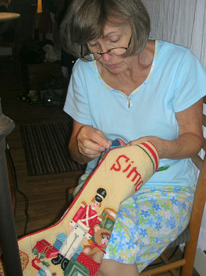 Baba puts finishing touches on Si's stocking