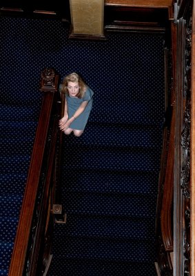 Rachel kneeing on stairs
