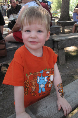Showing off his fish tattoo