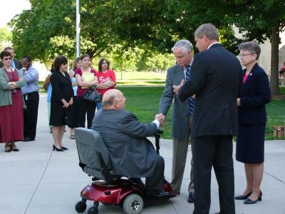 Mr. Pomerantz, Gov. Vilsack and Sen. McKinley, Rep. Tymeson