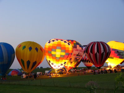 Night falls, balloons aglow