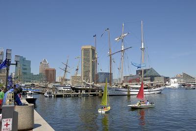 Little boats sailing around the harbor in Baltimore, MD.