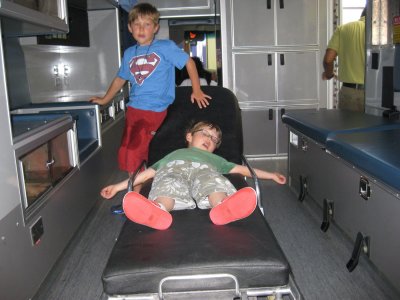 Pretending to be dead in an ambulance