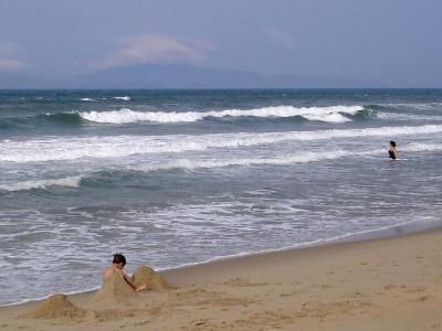 Cua Dai Beach, boy and woman