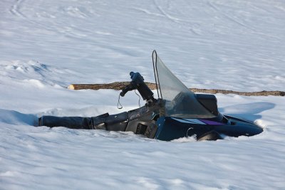 What's left of a snowmobile that went through