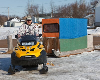 Leo Etherington with his snowmobile taxi 2011 April 8