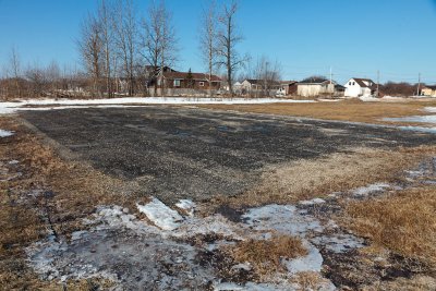 Asphalted area near baseball diamond