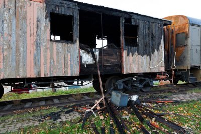 Fire damaged caboose at Cochrane Museum train
