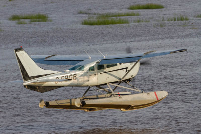 Bushland Airways Cessna U-206E C-FBGB takes off from the Moose River at Moosonee