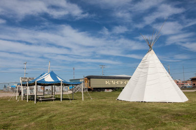 Tent and tipi near train station.