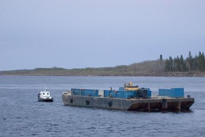 Tug moving barge downstream May 17, 2006