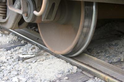 Derailed gravel cars - detail of wheel and track