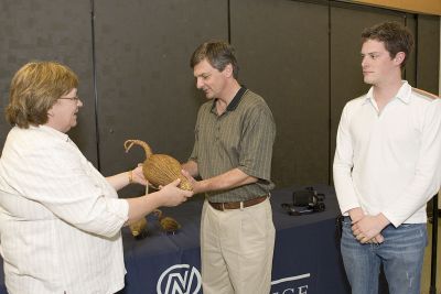 Diane Ryder presents Chris Bentley with a tamarack goose