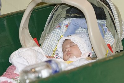 Baby sleeping through a wedding