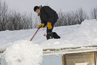 Snow shovelling - Anthony Isaac on the roof