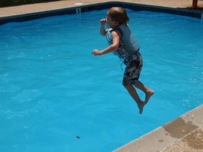 Adrian Jumping Into the Pool