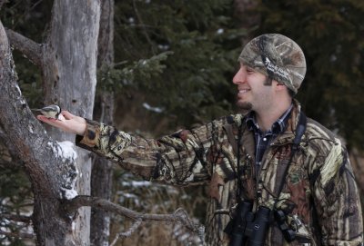 Aron feeding a Black-capped Chickadee