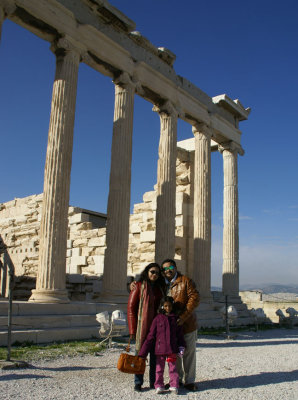 In front of the majestic columns of the Erechtheion.