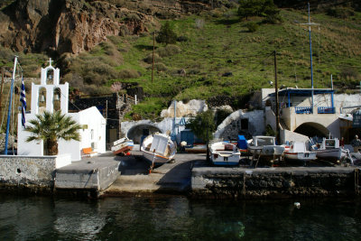 Mini church and boats at Santorini Harbor