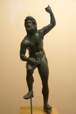 Statuette of the Greek God Poseidon in bronze.
