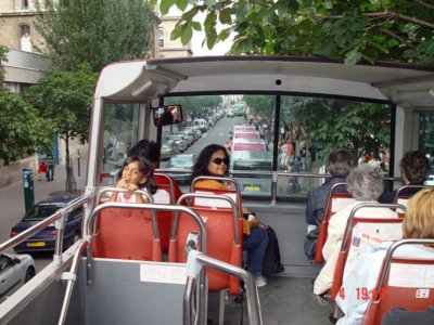 On the open air deck of the celebrated Red Tourbuses of Paris.