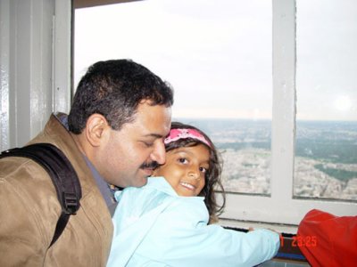 Uma and Dad at the top of the Eiffel Tower.