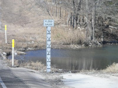 Several creeks have 5 ft flood gauge signs