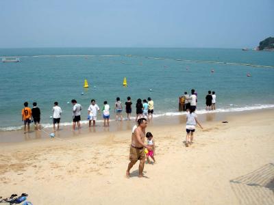 You don't see skimpy bathing suits at Hong Kong beaches, everyone covers up