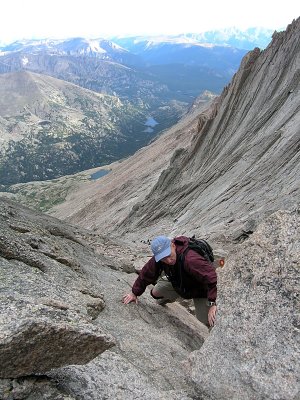 Wade negotiates the chockstone