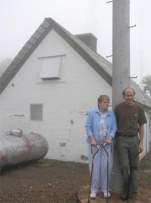 Mom and Rick pose with original 90 foot mast