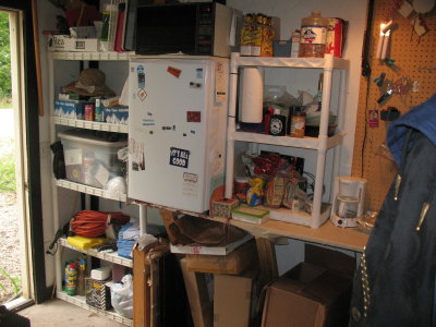 Kitchen on south wall (microwave, refridgerator, both shelves and counter included)