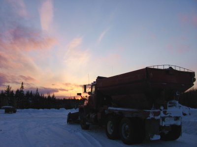 Red Plow Truck at Sunset