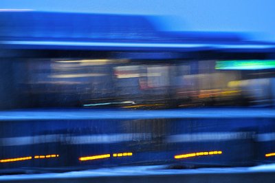 Blue bus passing