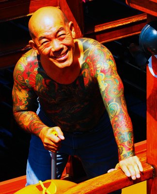 Tattooed boatman on Singapore River