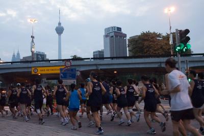 Running by Jalan Parlimen, with the Kuala Lumpur Tower in the background.