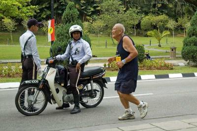 The friendly police cheering on a veteran runner