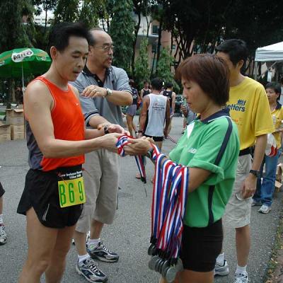 Handing out finisher's medal