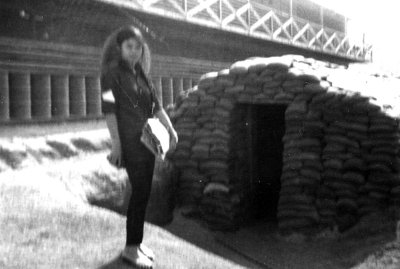 House girl in front of bunker.jpg