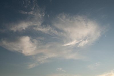 white man with long mustache floating in the sky