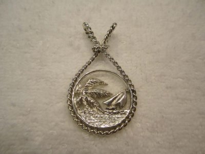 sterling silver pendant, hand carved under microscope