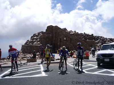 Riders get ready to head down with ruins in the background.