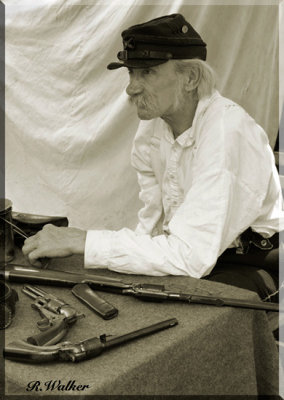 A Union Solder Sits With Weapons Making Them Ready