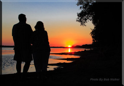 A Couple Enjoy An Evening's Sunset