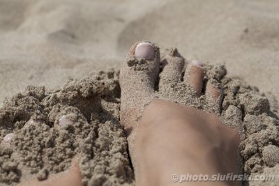 Sexy feet on a sandy beach