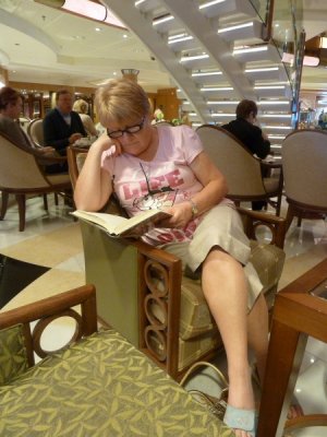 Grand Princess - 'The Piazza' Margaret reading her book