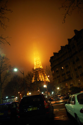 eiffel tower disappearing into the fog