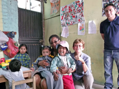 Alexander, me & NorQuest student with some of the children