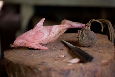 Dolphin being carved and ivory nut on right. IMG_9366.jpg