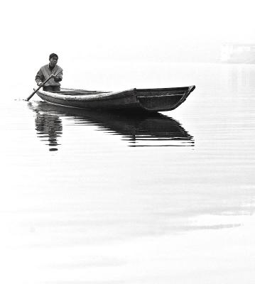 Paddling on the lake. Wangcun Village, Hunan Province, China